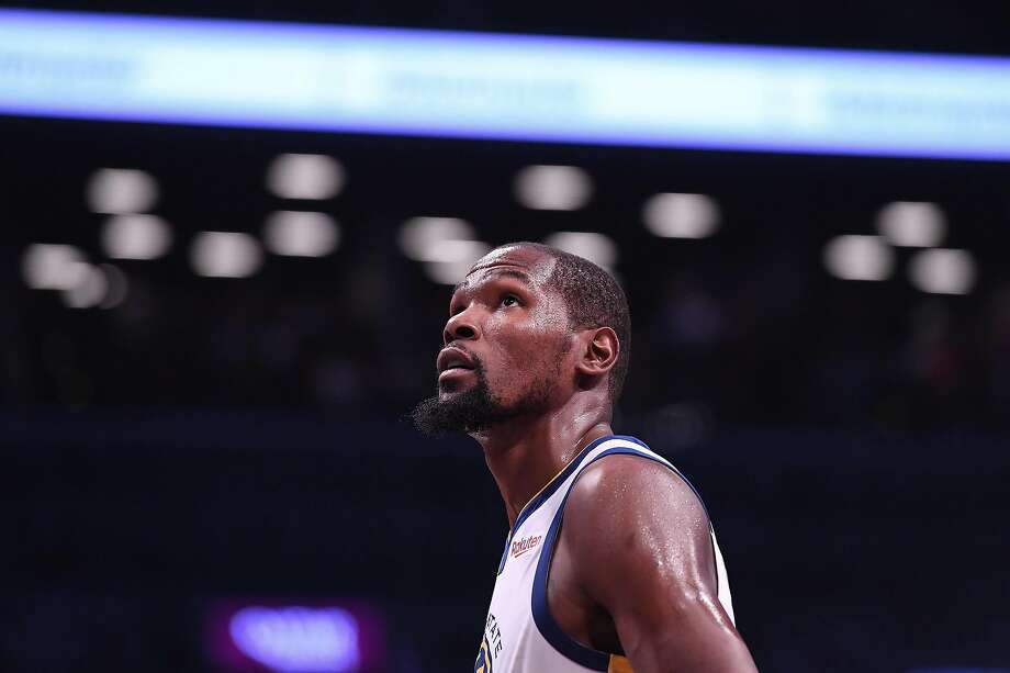 NEW YORK, NY - OCTOBER 28: Kevin Durant #35 of the Golden State Warriors during the game against the Brooklyn Nets at Barclays Center on October 28, 2018 in the Brooklyn borough of New York City. A new book from Warriors reporter Ethan Strauss covers the Warriors during the 2010s. Photo: Matteo Marchi, Getty Images