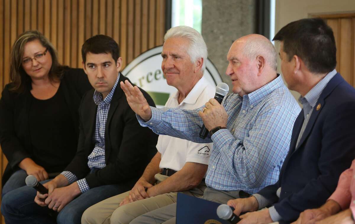 Agriculture Secretary Sonny Perdue makes a point as, from left, moderator Shannon Douglas, Reps Josh Harder, Jim Costa and TJ Cox look on during a town hall meeting on agriculture in the Central Valley on Friday, 6/28, 2019 at Los Banos Fairgrounds Park in Los Banos, California.
