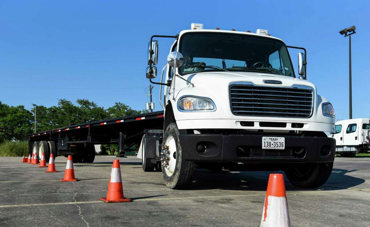 Students practice parking a truck during the CDL training in one of Lamar State College Port Arthur's parking lots which involved both pre-checking the trucks and driving them. Photo taken on Tuesday, 06/11/19. Ryan Welch/The Enterprise
