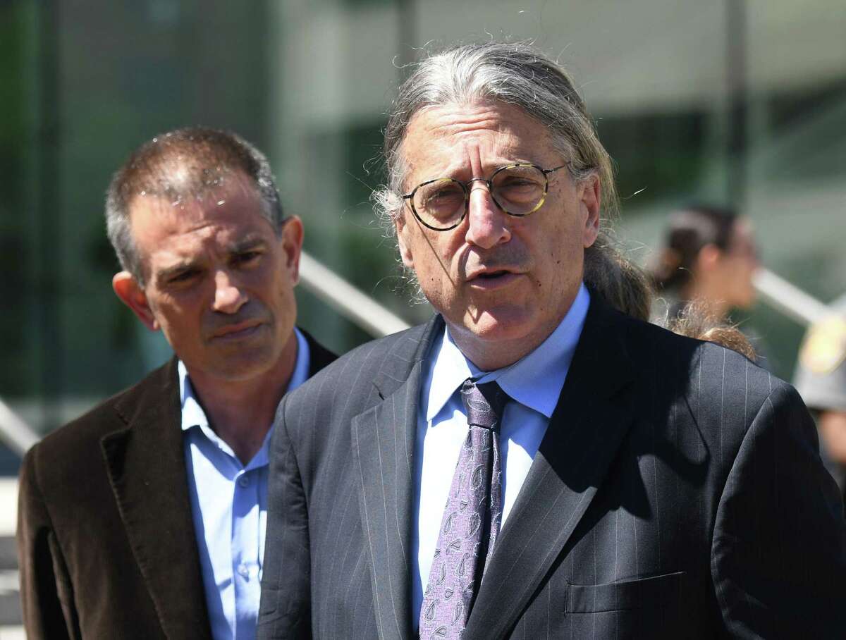 Fotis Dulos, left, is accompanied by his attorney Norm Pattis, after making an appearance at Connecticut Superior Court in Stamford, Conn. Wednesday, June 26, 2019.