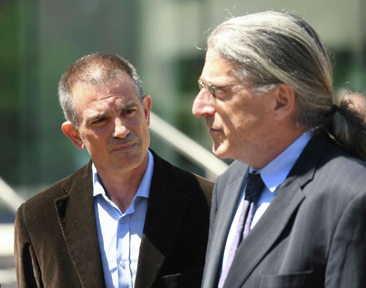 Fotis Dulos, left, is accompanied by his attorney Norm Pattis, after making an appearance at Connecticut Superior Court in Stamford, Conn. Wednesday, June 26, 2019. Fotis Dulos appeared with his attorneys, Norm Pattis and Rich Rochlin, for a hearing Wednesday on motion by a divorce attorney for Jennifer Dulos to have Fotis Dulos and his attorneys held in contempt and for the court to impose sanctions for violating a judge’s order that sealed a custody and psychological evaluation conducted on the Dulos family.