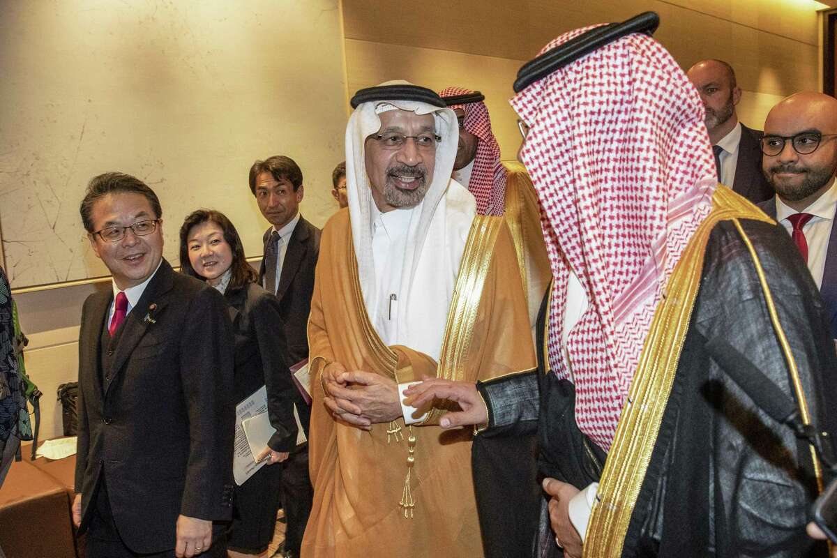 Saudi Arabia’s oil minister Khalid Al-Falih (c) in Japan recently.