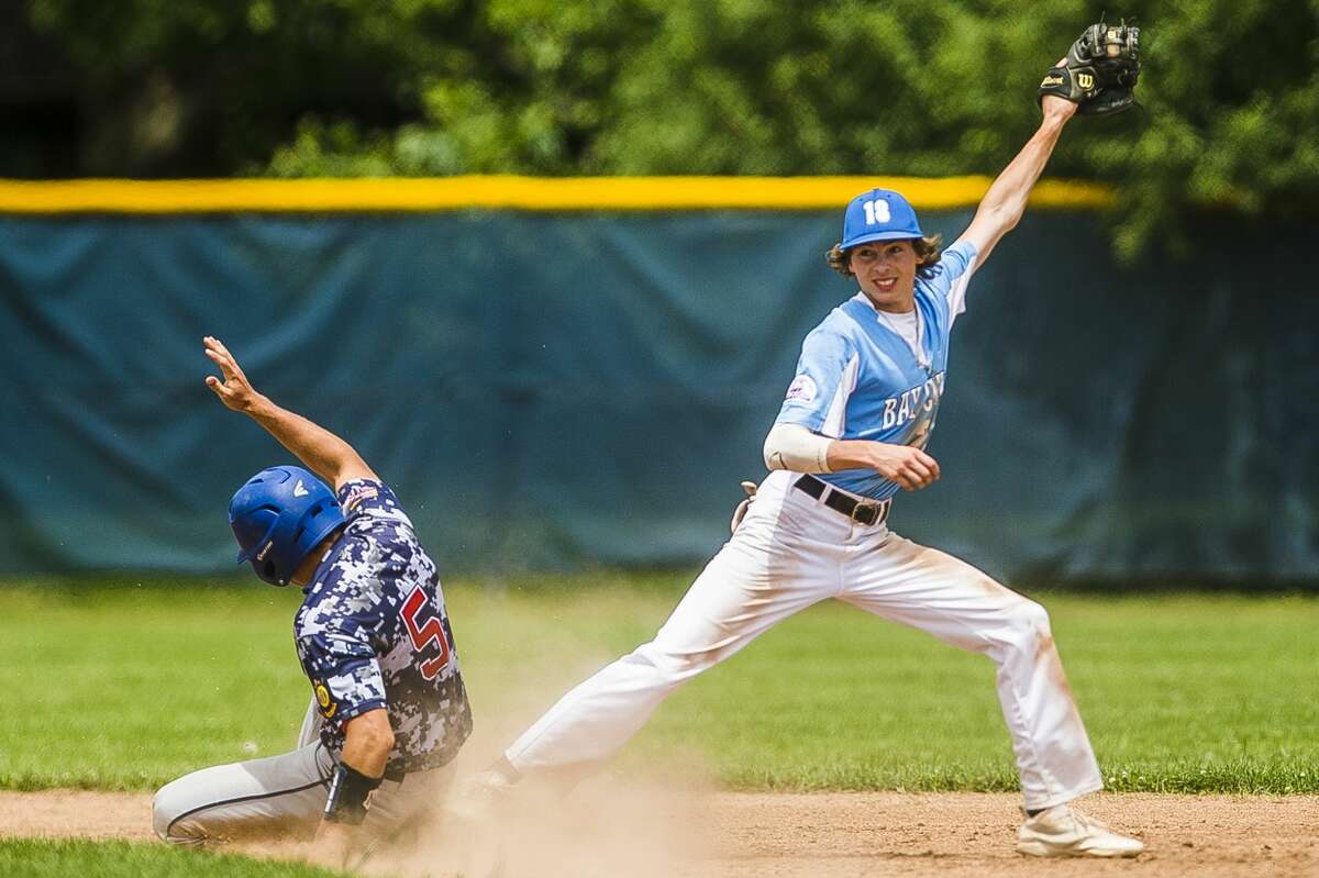 Gladwin Post 171's Justin Greer slides into second base during a game against Bay City in the Gabby Mills Invitational on Sunday, June 30, 2019 at Midland High School. (Katy Kildee/kkildee@mdn.net)