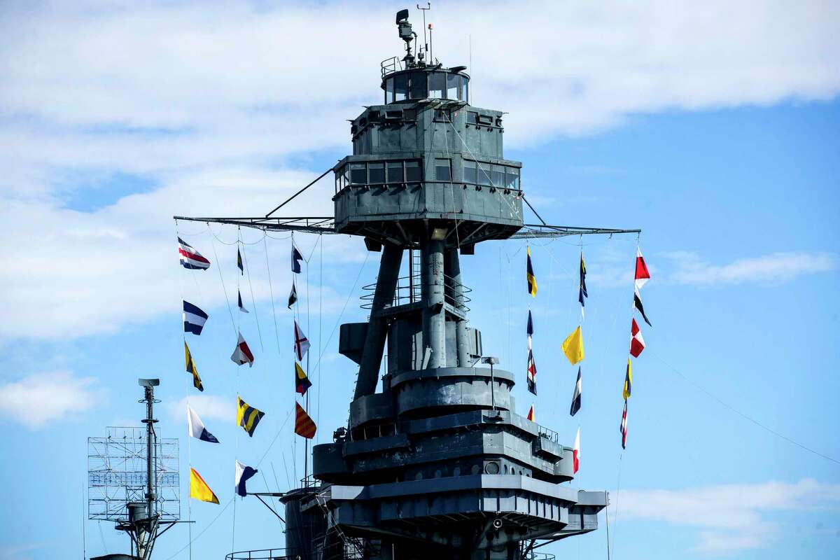 Flags fly atop the Battleship Texas on Thursday, June 6, 2019, in La Porte. The U.S.S. Texas was part of the D-Day operations in Normandy and is the last remaining battleship to have served during the invasion. She also served during World War I.