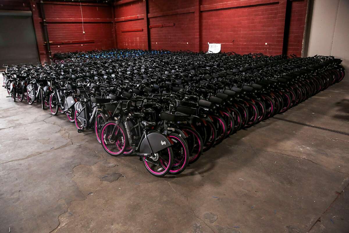 Brand new stationless Lyft electric bikes sit inside Lyft’s warehouse in Dogpatch Thursday, June 27, 2019, in San Francisco, Calif. Lyft is wrangling with with San Francisco Municipal Transportation Agency in court and as they work through a contract dispute, docks for the new electric bikes are empty while Lyft’s new electric bikes sit in a warehouse yet to be used.