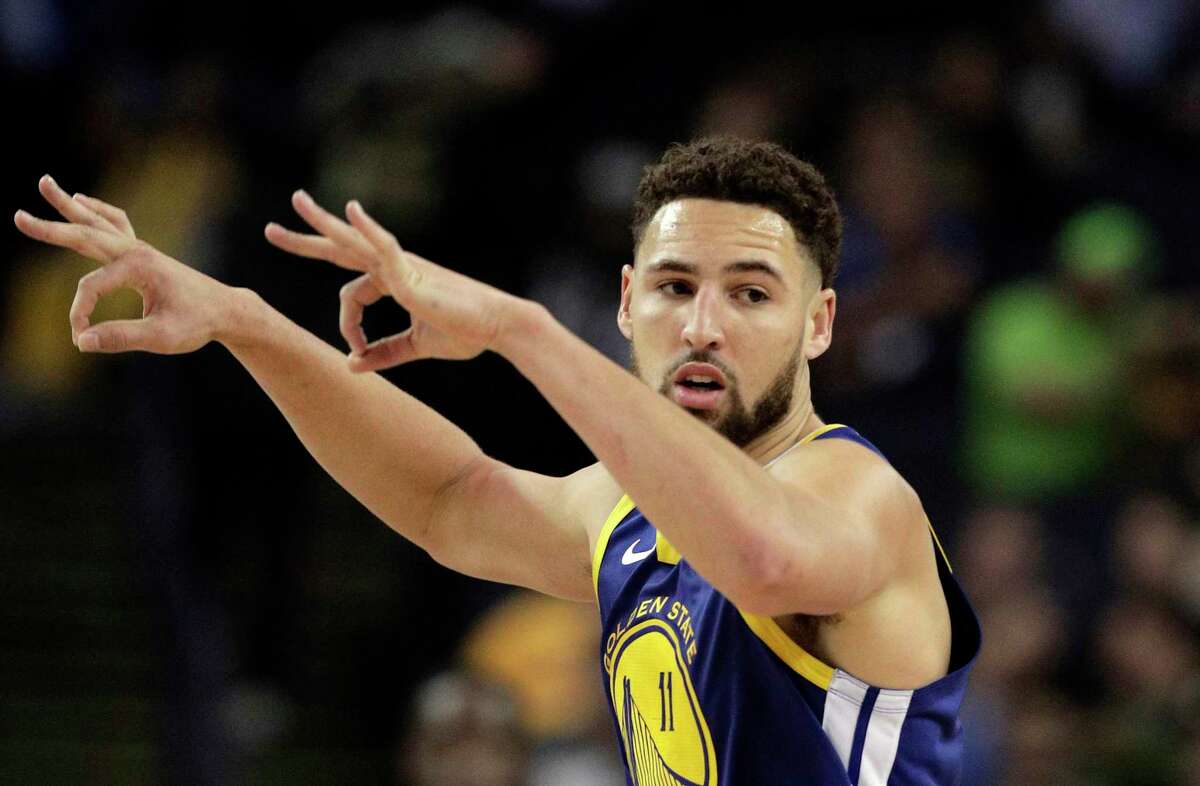 Klay Thompson (11) reacts to scoring a three pointer in the second half as the Golden State Warriors played the Atlanta Hawks at Oracle Arena in Oakland, Calif., on Tuesday, November 13, 2018.