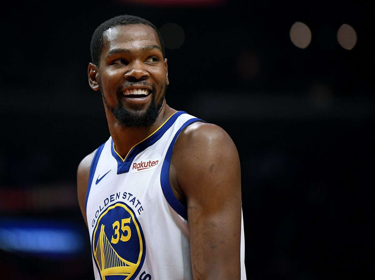FILE - JUNE 30, 2019: It was reported that Kevin Durant of the Golden State Warriors is planning to sign with the Brooklyn Nets June 30, 2019. LOS ANGELES, CALIFORNIA - APRIL 26: Kevin Durant #35 of the Golden State Warriors smiles at his bench in a 129-110 win over the LA Clippers during Game Six of Round One of the 2019 NBA Playoffs at Staples Center on April 26, 2019 in Los Angeles, California. (Photo by Harry How/Getty Images) NOTE TO USER: User expressly acknowledges and agrees that, by downloading and or using this photograph, User is consenting to the terms and conditions of the Getty Images License Agreement.