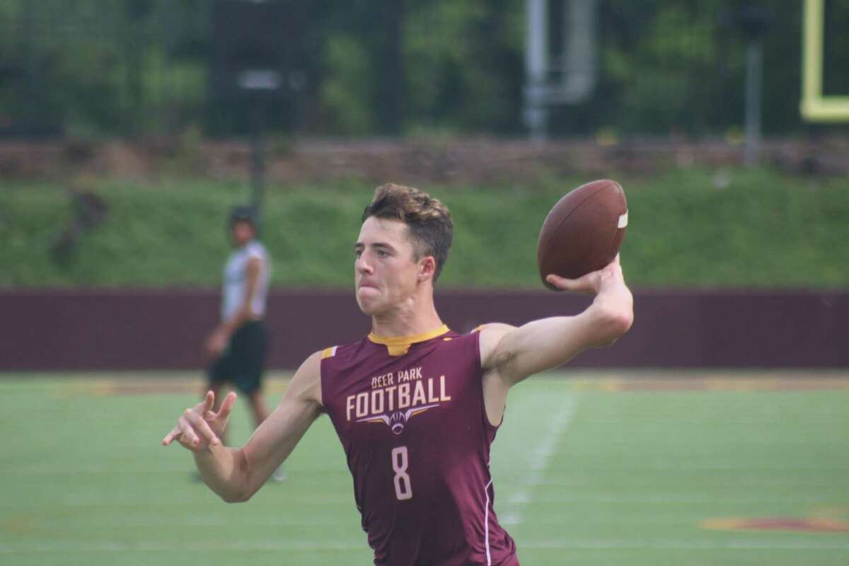 Matthew Potts gets ready to deliver a pass in the end zone during the final night of the local 7-on-7 league at Abshier Stadium last Thursday. The Deer QBs displayed improvement compared to the start of June.