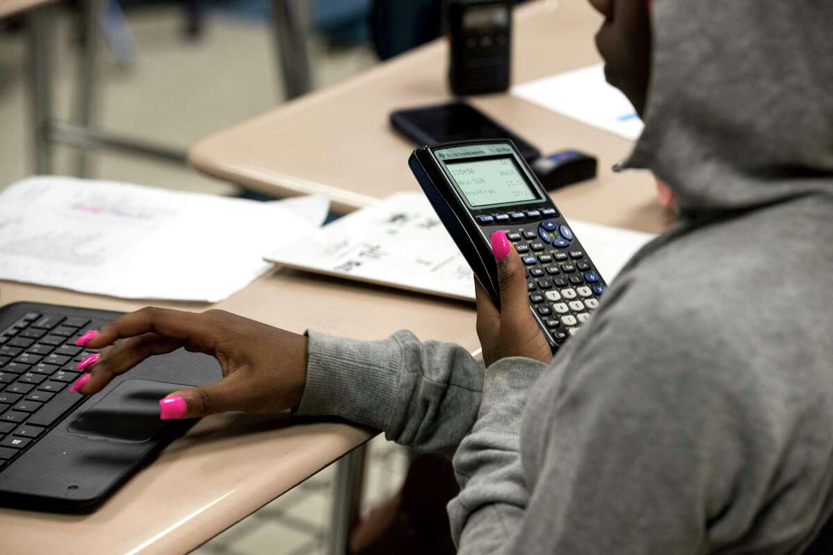 Students work on a math assignment at Kashmere High School on Thursday, June 27, 2019, in Houston.