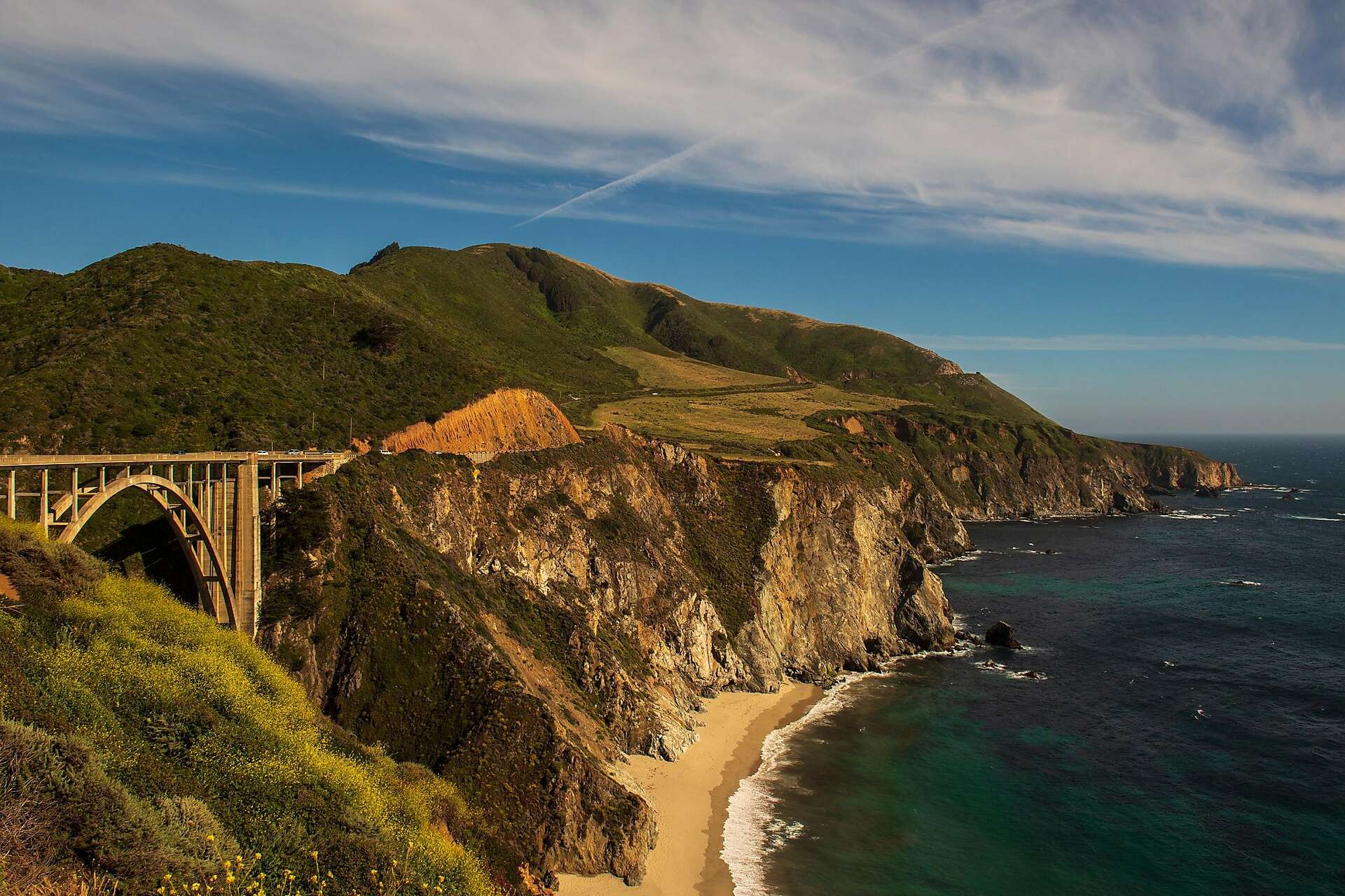 Overtourism is killing Big Sur sign appears on iconic Bixby Bridge