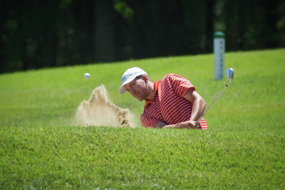 Austin Fox hits out of a sand trap on the 18th holed during the New York State Golf Association qualifiers for the State Amateur and the State Junior at the Colonie Golf and Country Club on Monday, July 1, 2019, in Voorheesville, N.Y. (Paul Buckowski/Times Union)