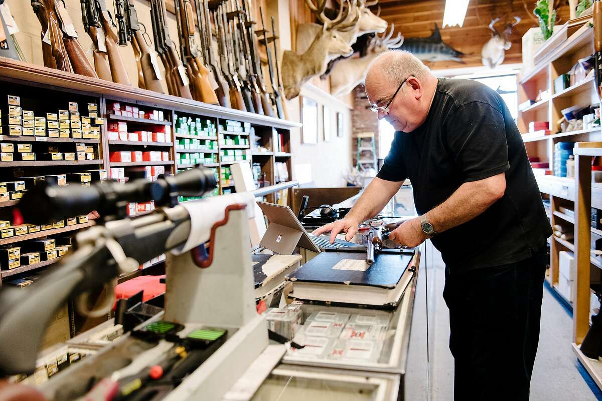 Employee George Morgan checks a gun while performing an inventory audit at Imbert & Smithers Inc. gunshot in San Carlos, CA on July 1st, 2019.