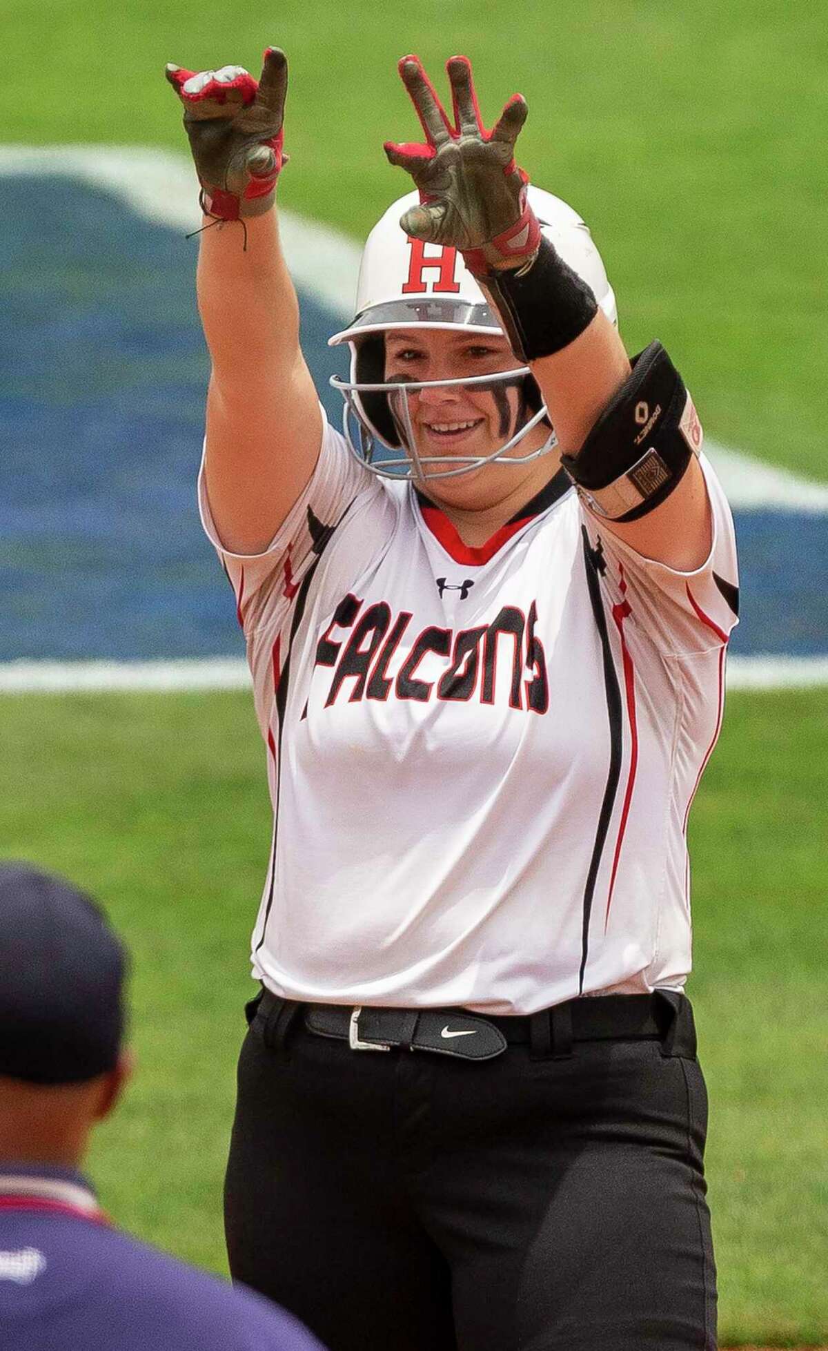 Huffman Hargrave runner Christin Haygood (17) celebrates her double against Fredericksburg during the UIL Class 4A state softball semifinal in Austin, Thursday, May 30, 2019.(Stephen Spillman / for Express-News)