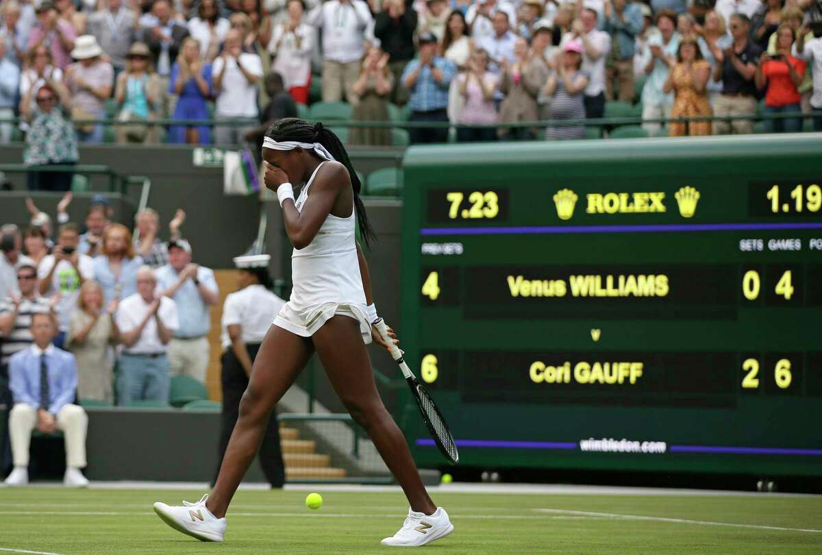 United States' Cori "Coco" Gauff reacts after beating United States's Venus Williams in a Women's singles match during day one of the Wimbledon Tennis Championships in London, Monday, July 1, 2019. (AP Photo/Tim Ireland)