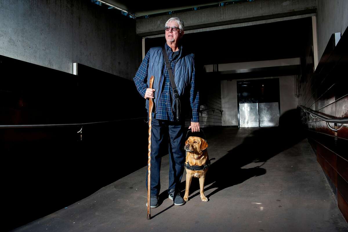 San Francisco Giants broadcaster Mike Krukow and his service dog Patriot at Oracle Park.