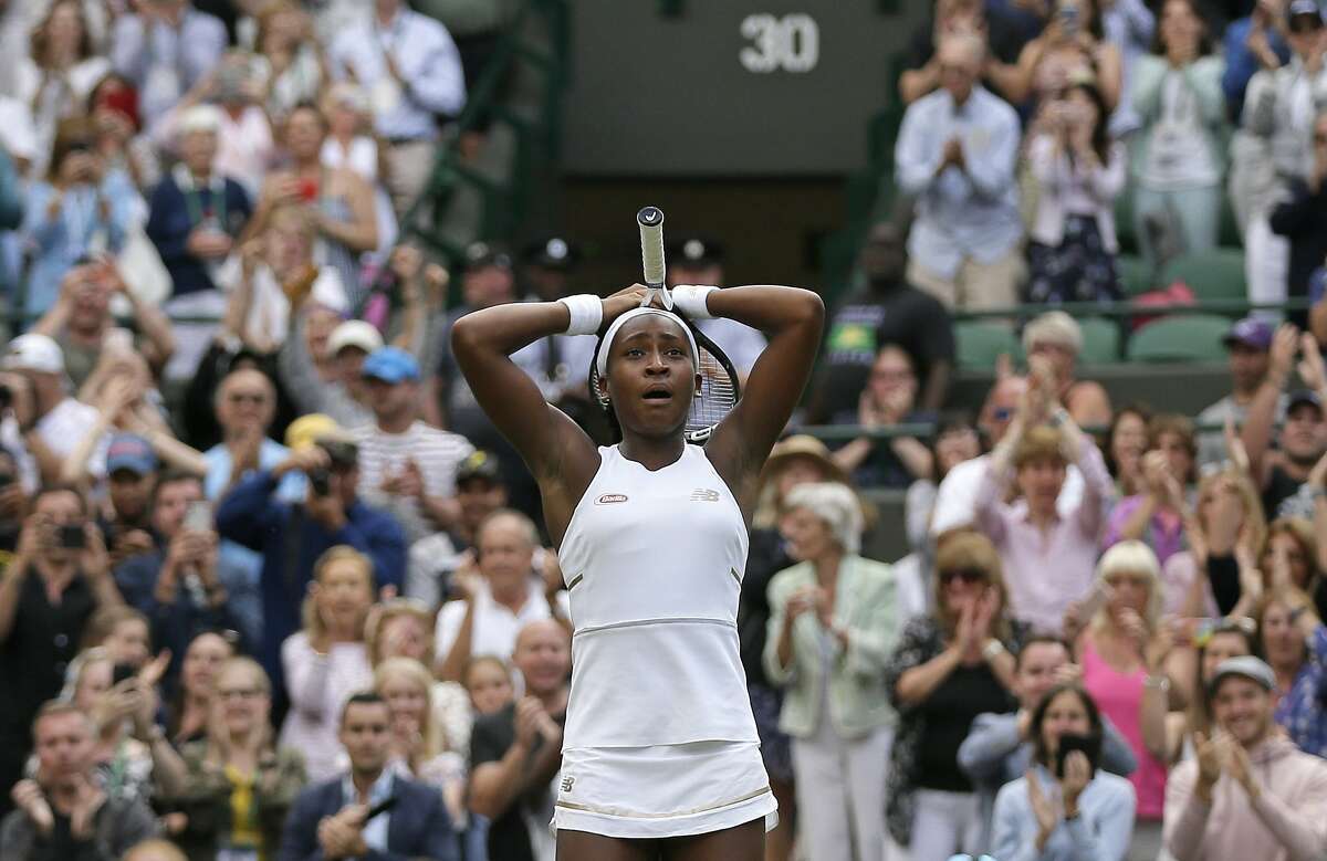 United States' Cori "Coco" Gauff reacts after beating United States's Venus Williams in a Women's singles match during day one of the Wimbledon Tennis Championships in London, Monday, July 1, 2019. (AP Photo/Tim Ireland)