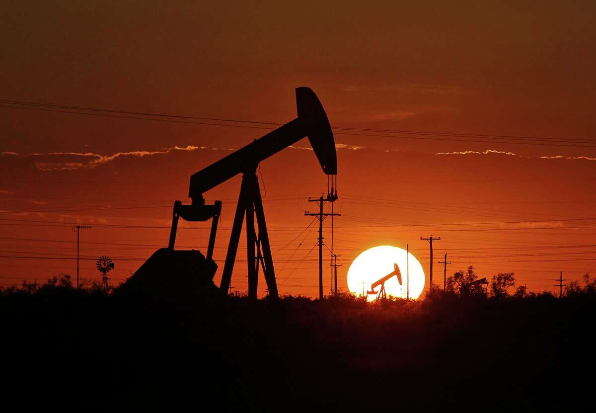 A pump jack operates in an oil field, Tuesday, June 11, 2019, in the Permian Basin in Texas.