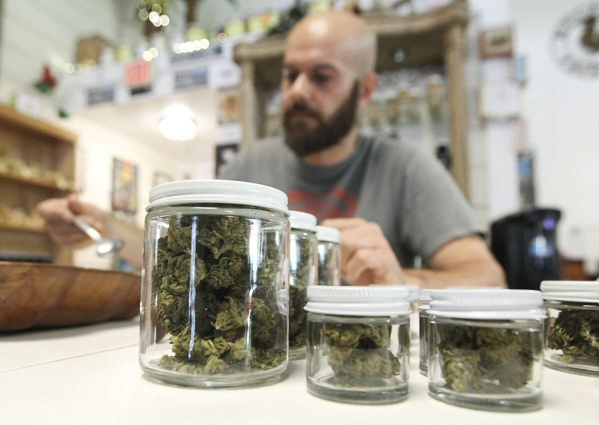 Hemp flowers are seen in containers at Happy Hippy Haus on Texas-105, Tuesday, July 2, 2019, in Cleveland.