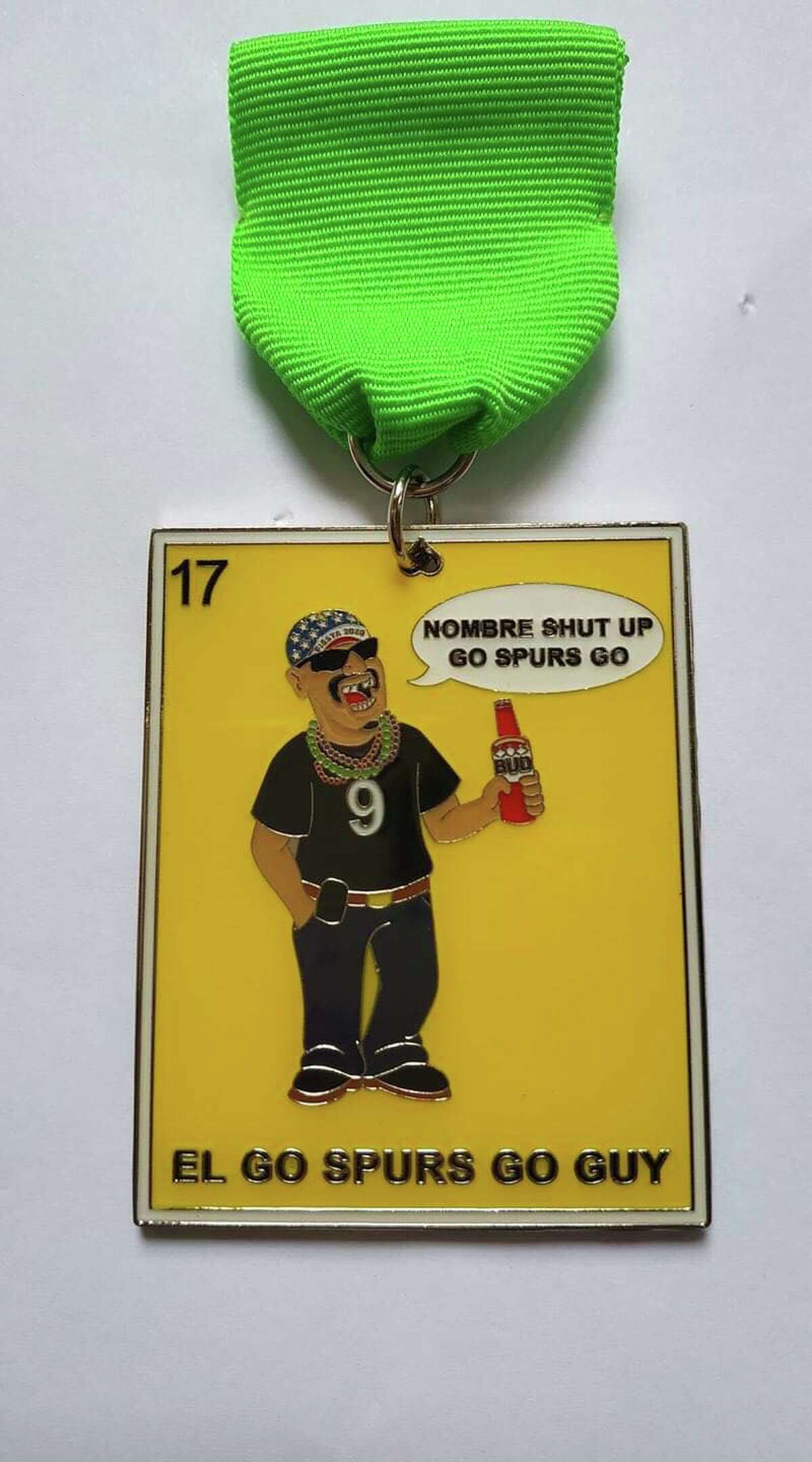 A front runner in the 2020 collectibles is the resurgence of the 2017 Market Square star, Felipe Aldape, better known as the "Nombre Shut Up, Go Spurs Go" guy. His caricature is on a lotería-style medal called "El Go Spurs Go Guy" designed by Diana Gonzalez, owner of Diana's Medals.