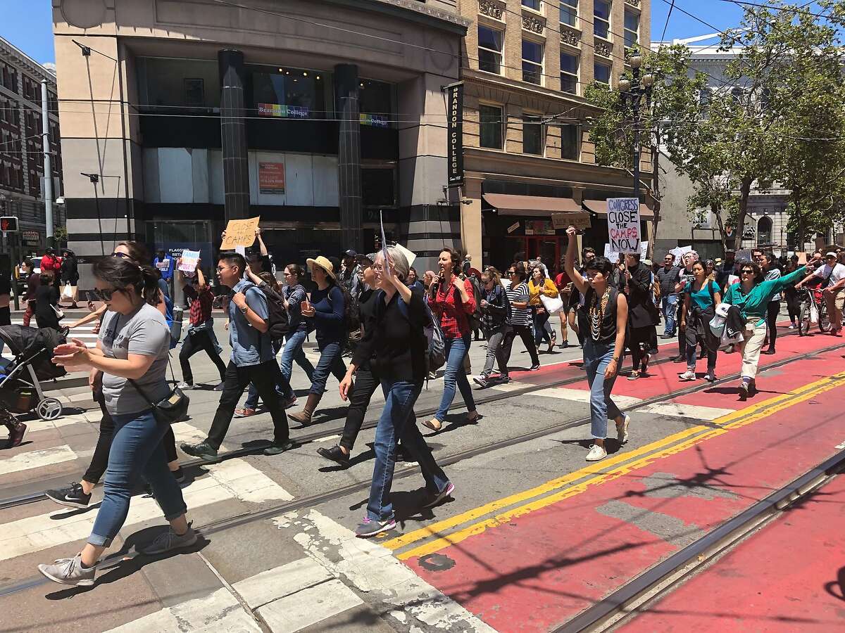 Demonstrators march up Market Street towards the Federal Building to protest migrant detentions on Tuesday, July 2, 2019.