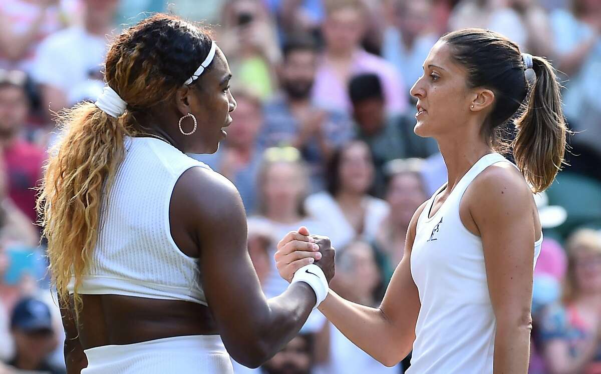 US player Serena Williams is congratulated by Italia's Giulia Gatto-Monticone after beating her during their women's singles first round match on the second day of the 2019 Wimbledon Championships at The All England Lawn Tennis Club in Wimbledon, southwest London, on July 2, 2019. (Photo by Glyn KIRK / AFP) / RESTRICTED TO EDITORIAL USEGLYN KIRK/AFP/Getty Images
