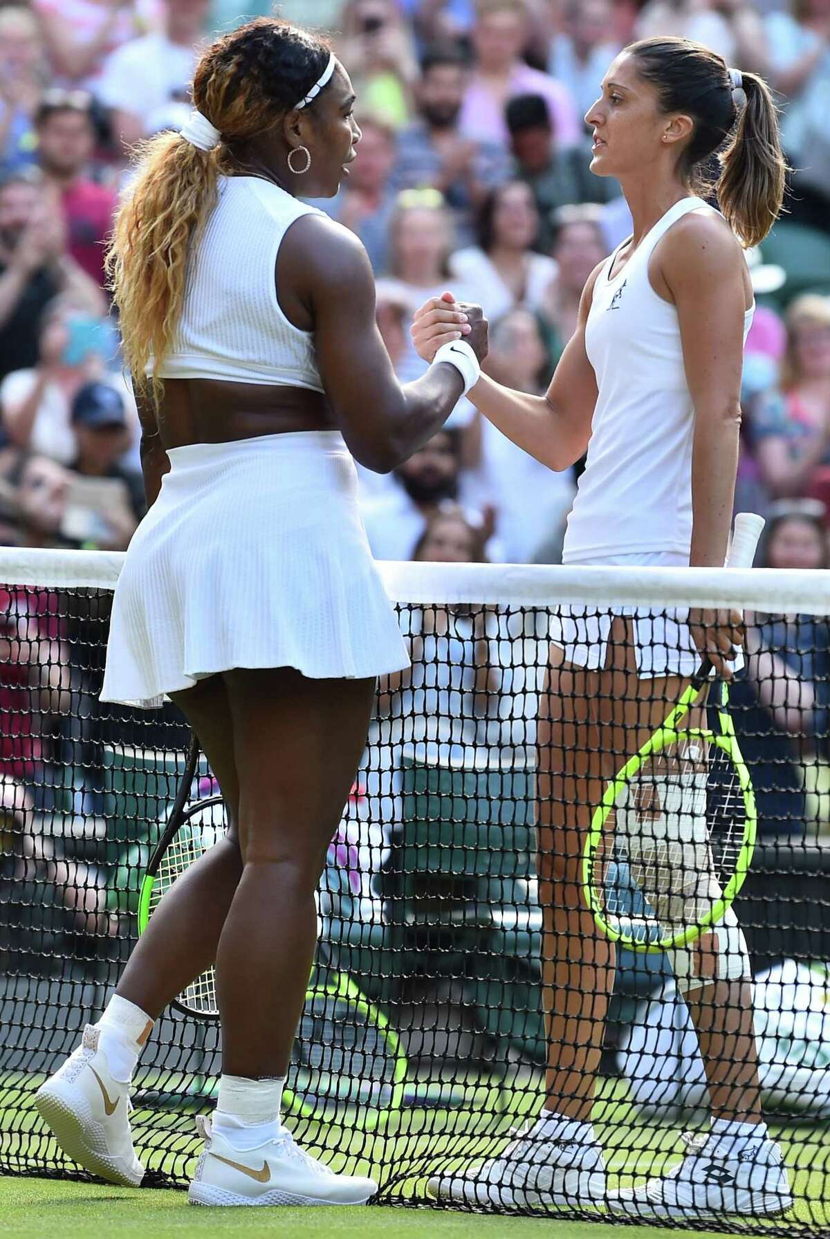 US player Serena Williams is congratulated by Italia's Giulia Gatto-Monticone after beating her during their women's singles first round match on the second day of the 2019 Wimbledon Championships at The All England Lawn Tennis Club in Wimbledon, southwest London, on July 2, 2019. (Photo by Glyn KIRK / AFP) / RESTRICTED TO EDITORIAL USEGLYN KIRK/AFP/Getty Images