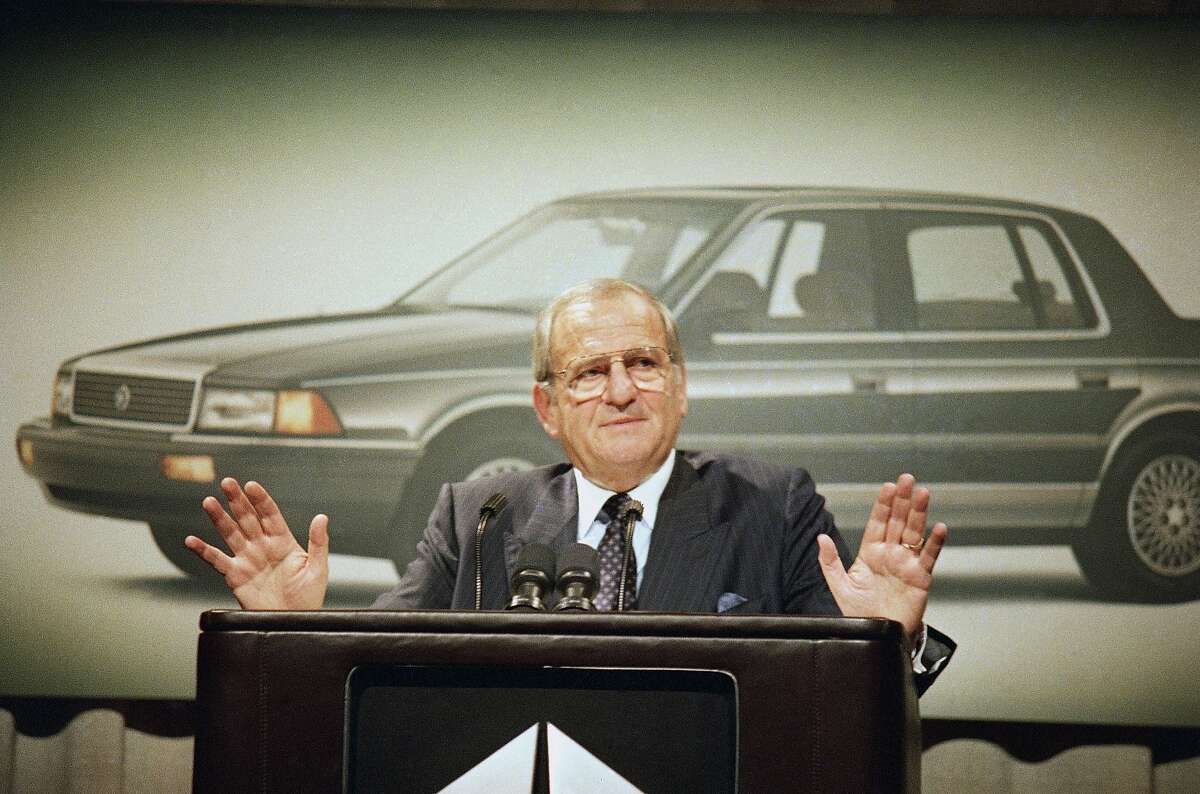 FILE - In this Feb. 2, 1989, file photo, Chrysler Corp. Chairman Lee Iacocca gestures while speaking about fourth quarter pre-tax earnings which are up 23.8 percent for the automaker at Grand Hyatt Hotel, New York. Former Chrysler CEO Iacocca, who became a folk hero for rescuing the company in the '80s, has died, former colleagues said Tuesday, July 2, 2019. He was 94. (AP Photo/Mario Cabrera, File)