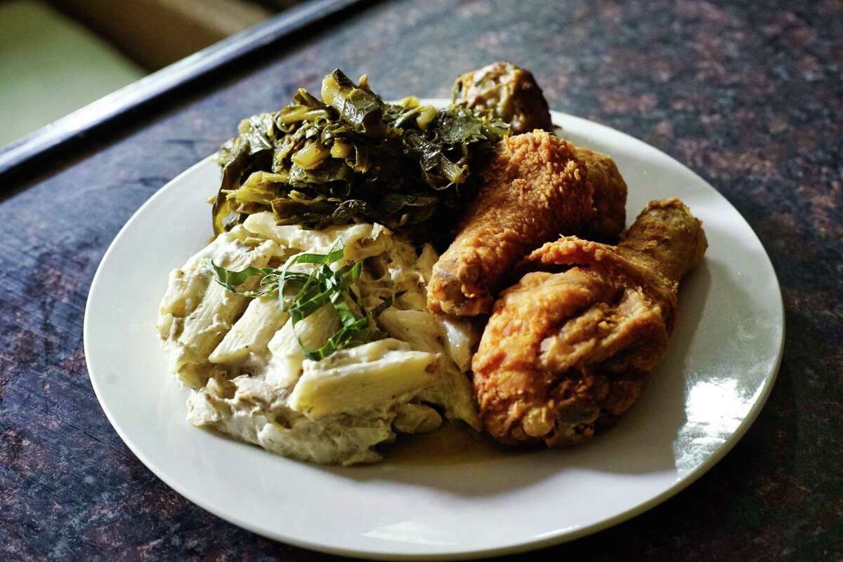 A view of a plate of fried chicken, macaroni salad and collard greens at Allie B's Cozy Kitchen on Tuesday, June 11, 2019, in Albany, N.Y. (Paul Buckowski/Times Union)