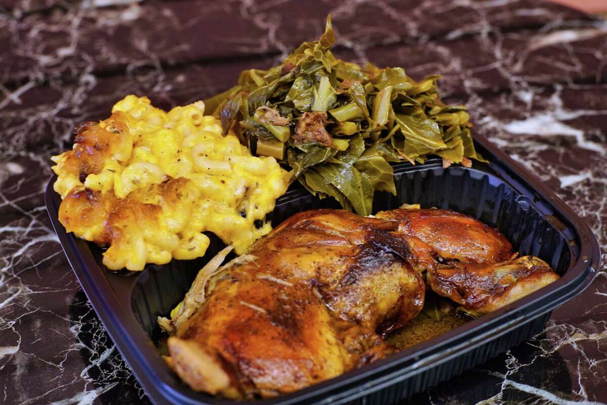 A view of cooked chicken, macaroni and cheese, and collard greens at Kitchen 216, on Tuesday, June 11, 2019, in Albany, N.Y. (Paul Buckowski/Times Union)