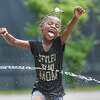 Kahshahvea Leroy, 6, cools off from the heat at the splash pad at Swinburne Park on Wednesday, July 3, 2019, in Albany, N.Y. (Paul Buckowski/Times Union)