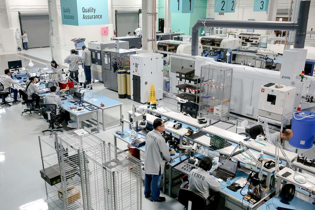 The from the mezzanine level of the quality assurance line on the factory floor at Tempo Automation on Wednesday, June 19, 2019, in San Francisco, Calif. Tempo Automation has a prototyping factory, making circuit boards for companies developing products in a range of industries. Operators on the factory floor are trained in software skills to help program the machinery they are working with. These software skills not only empower workers but also provide a digital thread to connect everyone in the process from software engineers to operators on the factory floor below them.