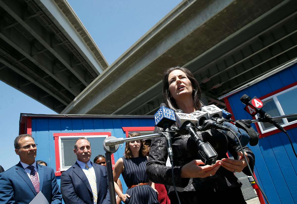 Mayor Libby Schaaf tours the new portable shed community for homeless residents below the MacArthur Maze in Oakland, Calif. on Wednesday, July 3, 2019. The first of the 80 or so residents are scheduled to move into the tiny homes near Wood and 34th streets on Sunday.