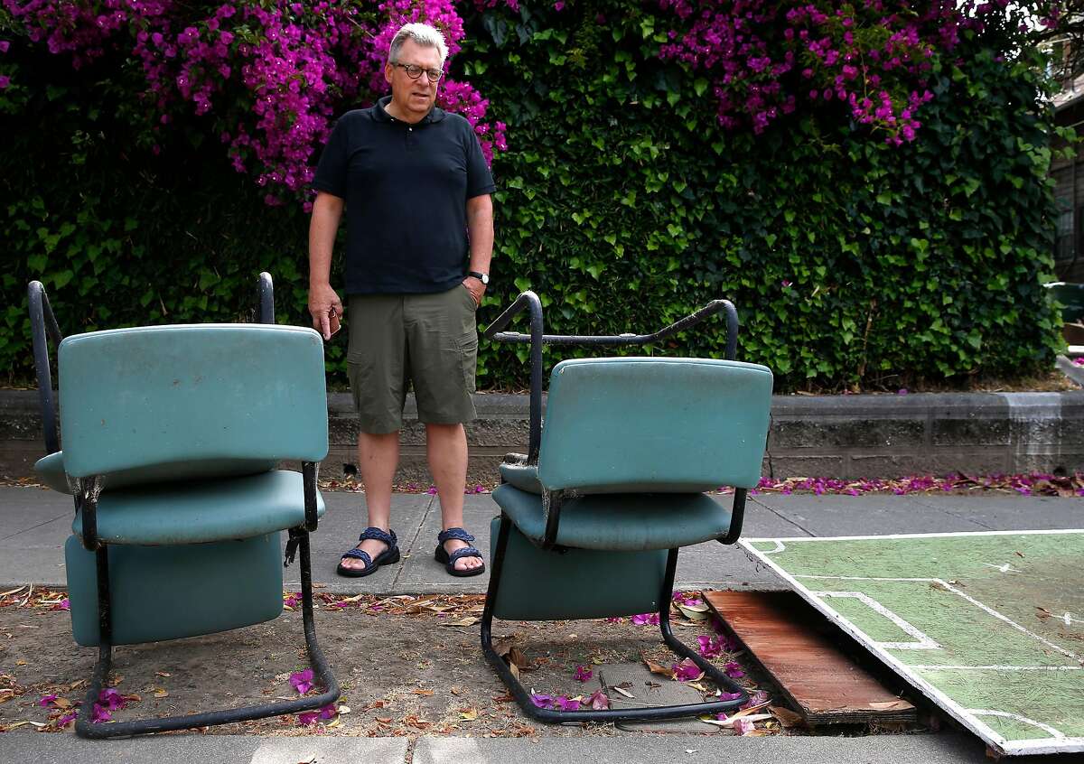 Phil Bokovoy pauses to view abandoned furniture and debris left behind on Benvenue Avenue after Cal students have moved out of apartments for the summer break in Berkeley, Calif. on Thursday, June 27, 2019. Bokovoy is among a group of residents who have filed lawsuits against UC Berkeley over the negative impact that the rising student enrollment has had on the surrounding neighborhoods.