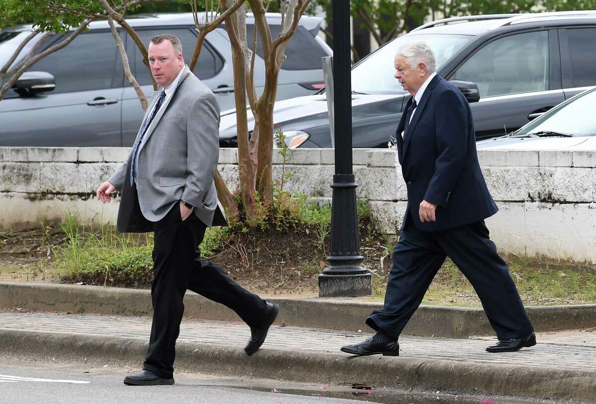From left, Brian Tillery and his father Larry Tillery walk into the Federal Courthouse in Beaumont on Tuesday. Photo taken Tuesday, 6/25/19