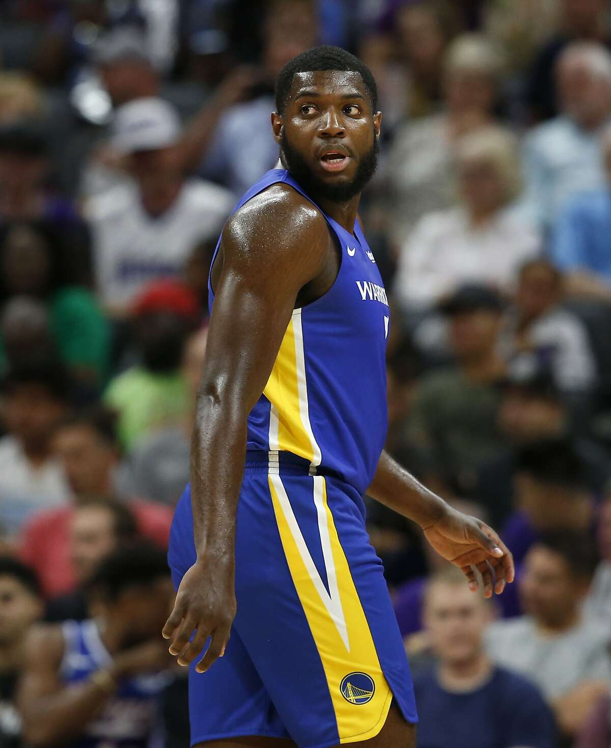 In this photo taken Monday July 1, 2019 Golden State Warriors forward Eric Paschall walks down court during the first half of an NBA basketball summer league game against the Sacramento Kings in Sacramento, Calif. The Kings won 81-77. (AP Photo/Rich Pedroncelli)