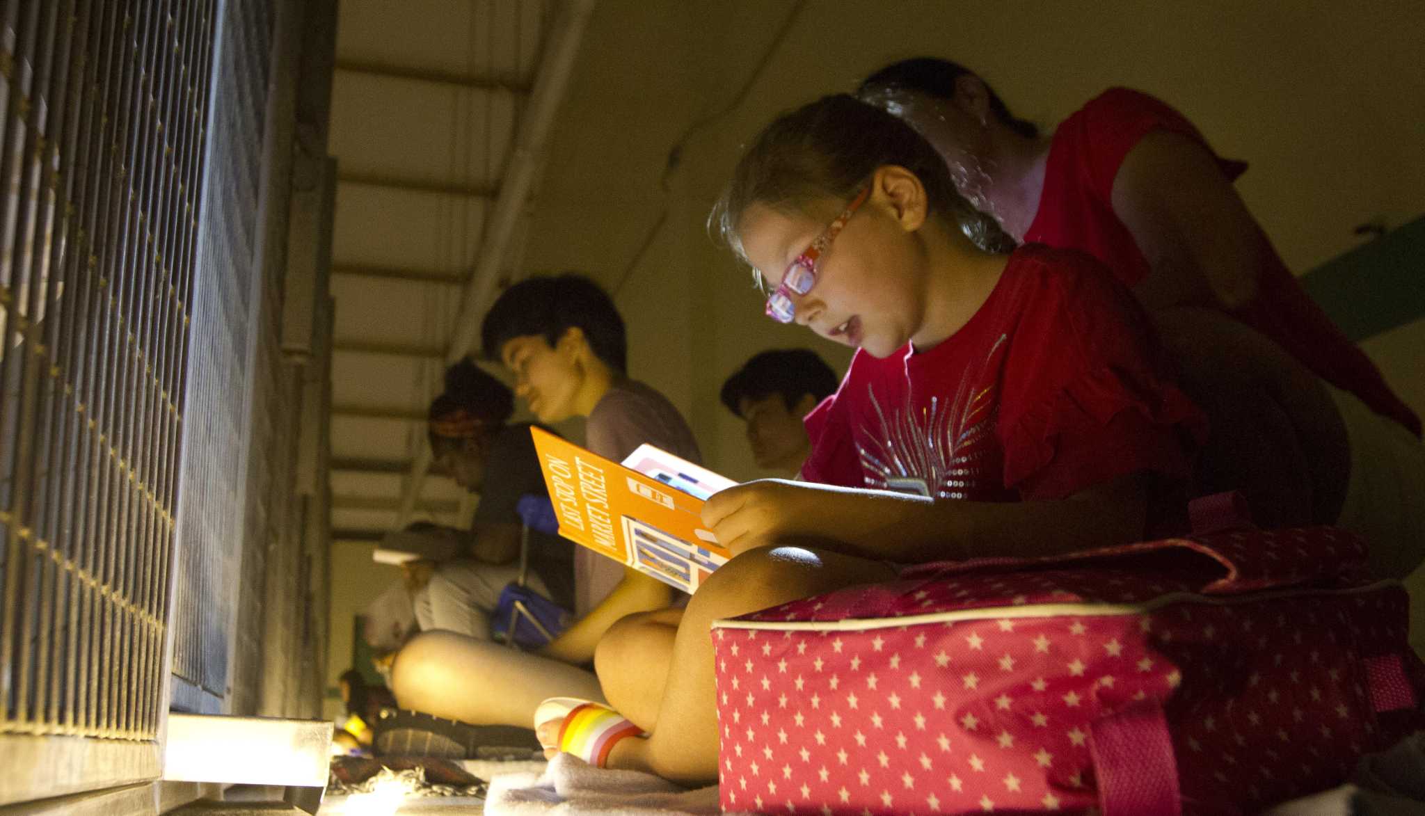 Volunteers read to dogs at Montgomery County Animal Shelter