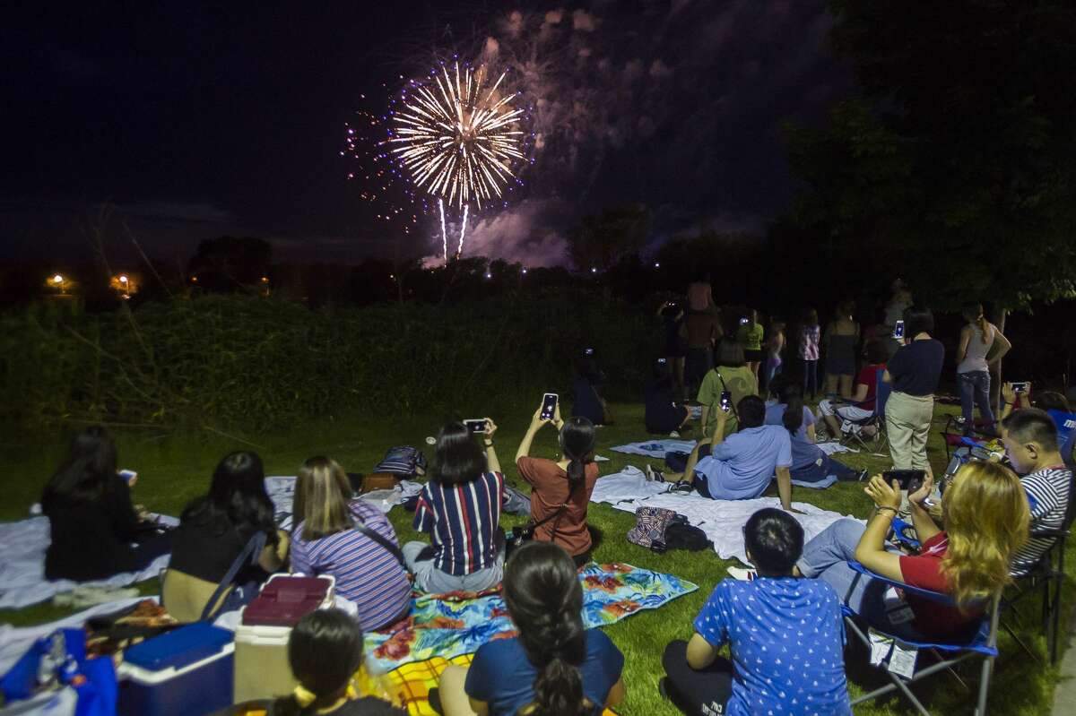 Thousands of people gather near Dow Diamond to watch fireworks on Thursday, July 4, 2019 in Midland. (Katy Kildee/kkildee@mdn.net)