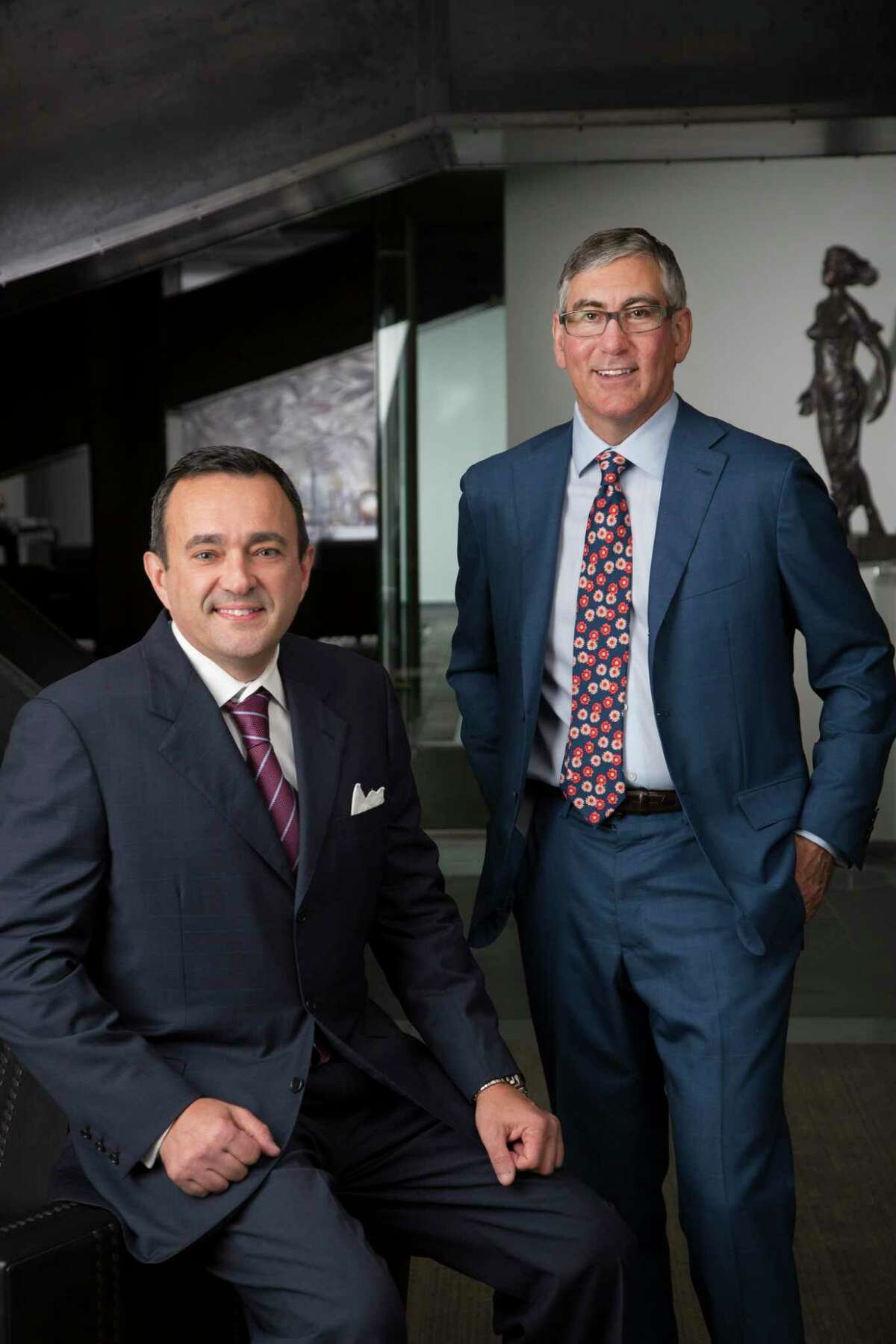John Zavitsanos, seated, and Joe Ahmad, founding partners of Ahmad, Zavitsanos, Anaipakos, Alavi & Mensing. AZA was one of only two Texas-based law firms to make a list of elite law firms generating more than $1 million in revnues per lawyer.