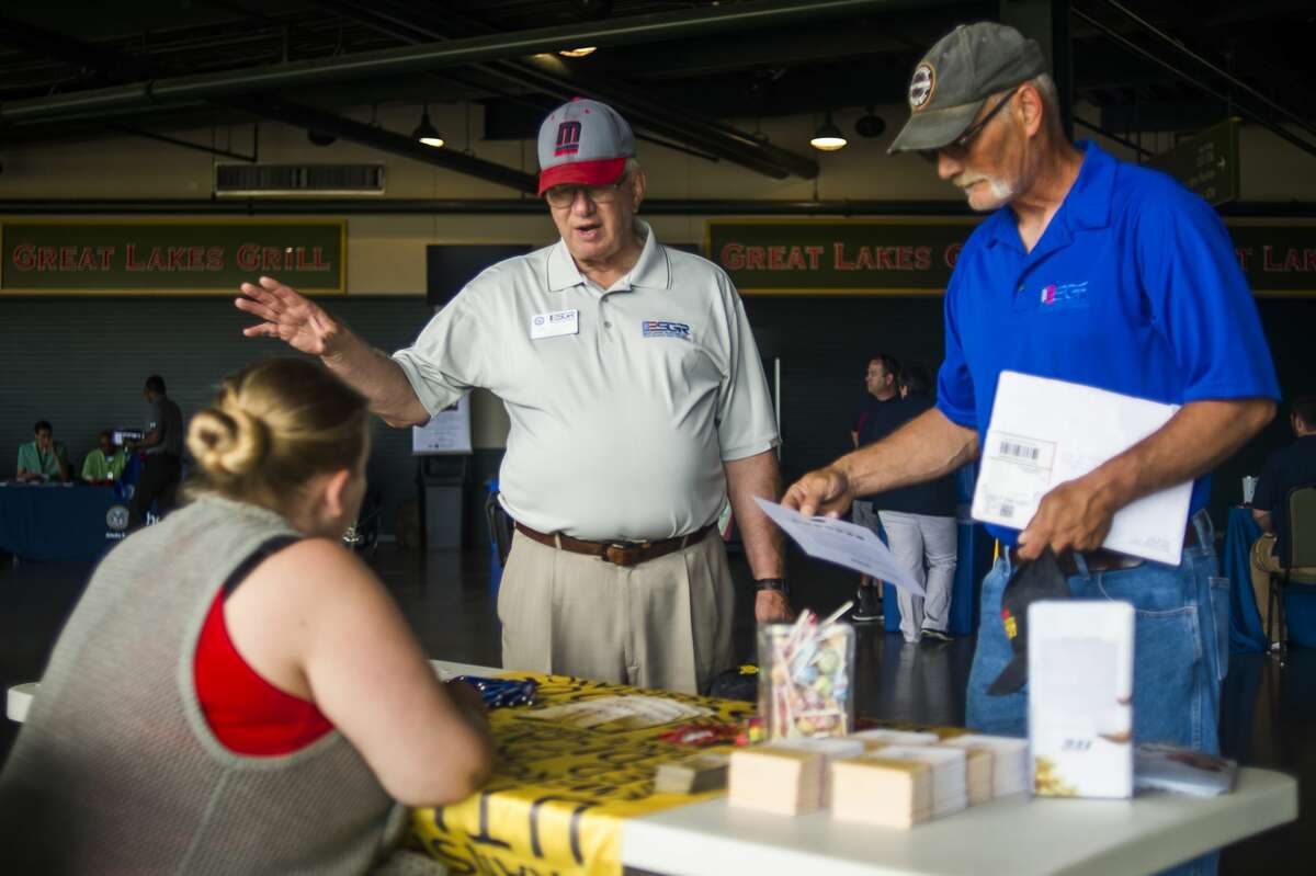 Guests peruse booths representing dozens of organizations during a veterans expo hosted by the Veterans Community Action Team Region 5 on Wednesday, July 3, 2019 at Dow Diamond in Midland. (Katy Kildee/kkildee@mdn.net)