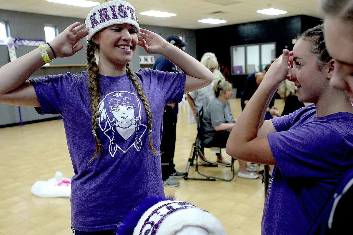 Indianettes captain Kristen Crippen jokes with Channing Hebert as the Indianettes gather during a headdress building workday at Port Neches - Groves High School Monday. Photo taken Monday, June 24, 2019 Kim Brent/The Enterprise
