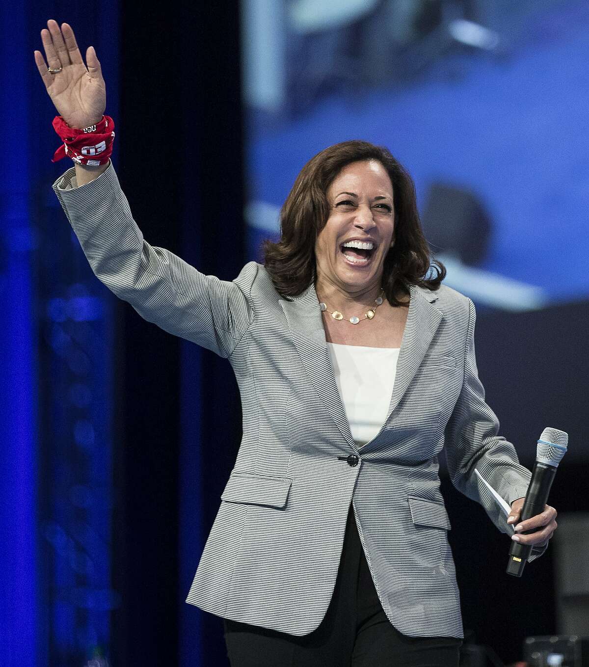 Democratic presidential hopeful, California Sen. Kamala Harris, waves as she arrives on stage to speak during the National Education Association Strong Public Schools Presidential Forum on Friday, July 5, 2019, in Houston.
