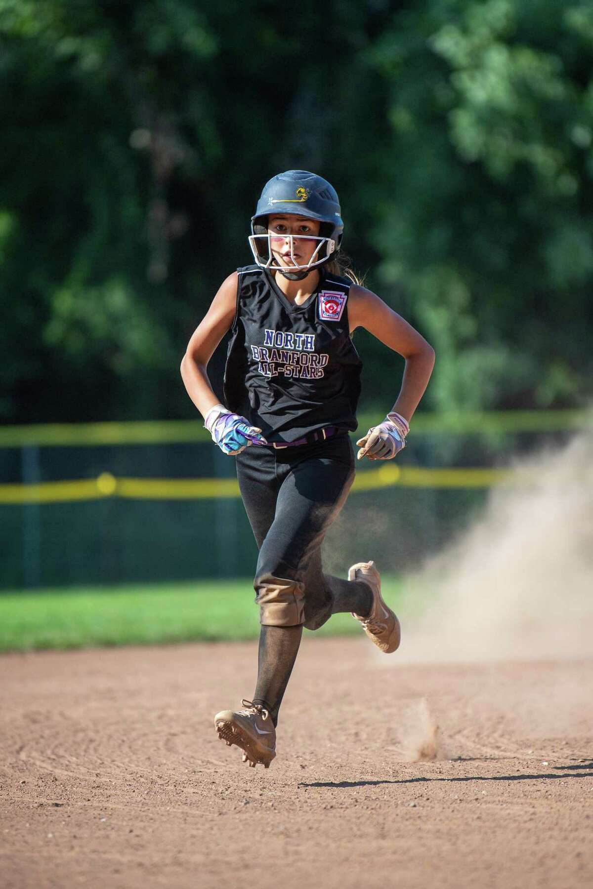 North Branford’s Lindsey Onofrio heads to third during the District IV championship game, Friday, July 5, 2019, at Foote Field in Milford, CT