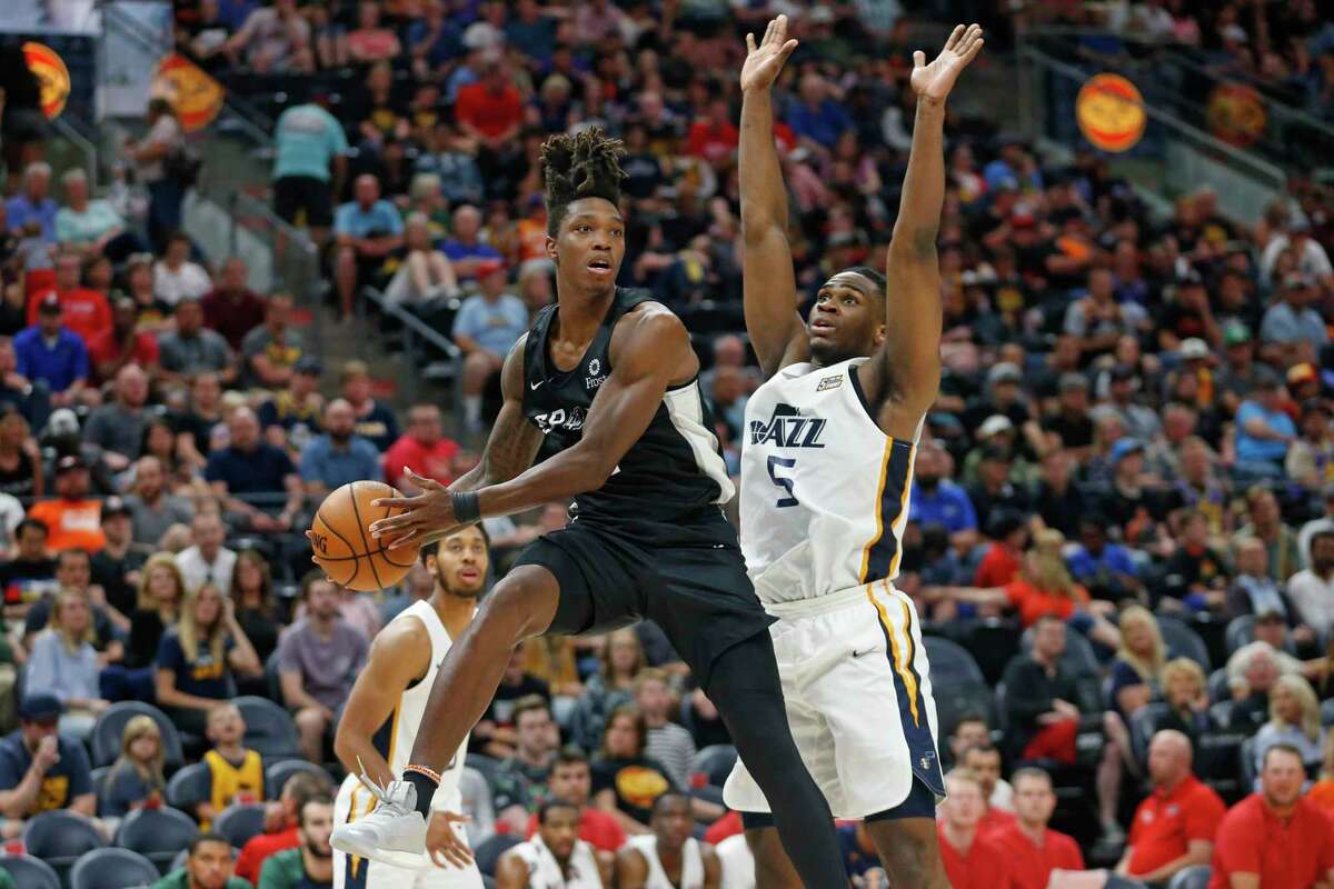 Spurs guard Lonnie Walker IV, left, continued his stellar play in the summer league. Walker scored 28 points in 23 minutes.
