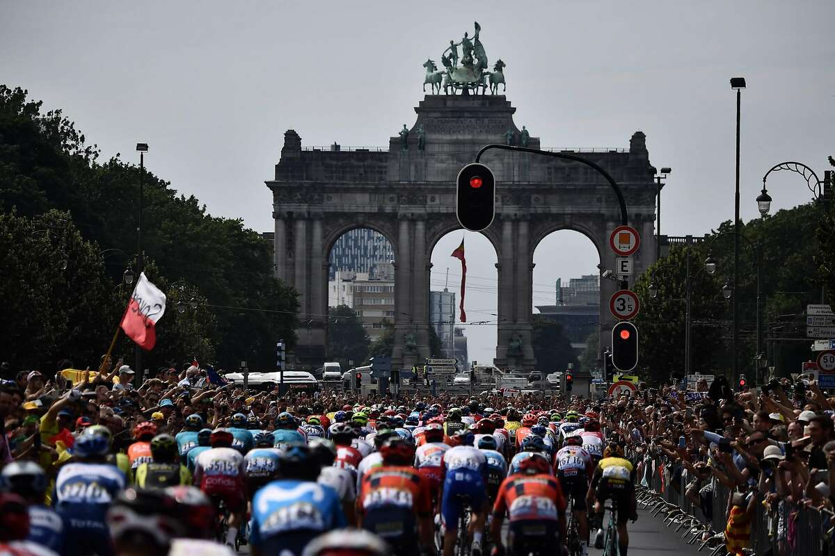 Riders arrive at the triple arches of the Arcades du Cinquantenaire in the first stage of the 106th edition of the Tour de France cycling race between Brussels and Brussels, Belgium, on July 6, 2019. (Photo by JEFF PACHOUD / POOL / AFP)JEFF PACHOUD/AFP/Getty Images