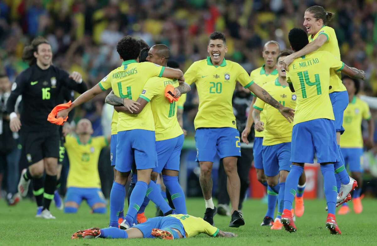 Brazil's players celebrate their 3 -1 victory over Peru in the final match of the Copa America at Maracana stadium in Rio de Janeiro, Brazil, Sunday, July 7, 2019.