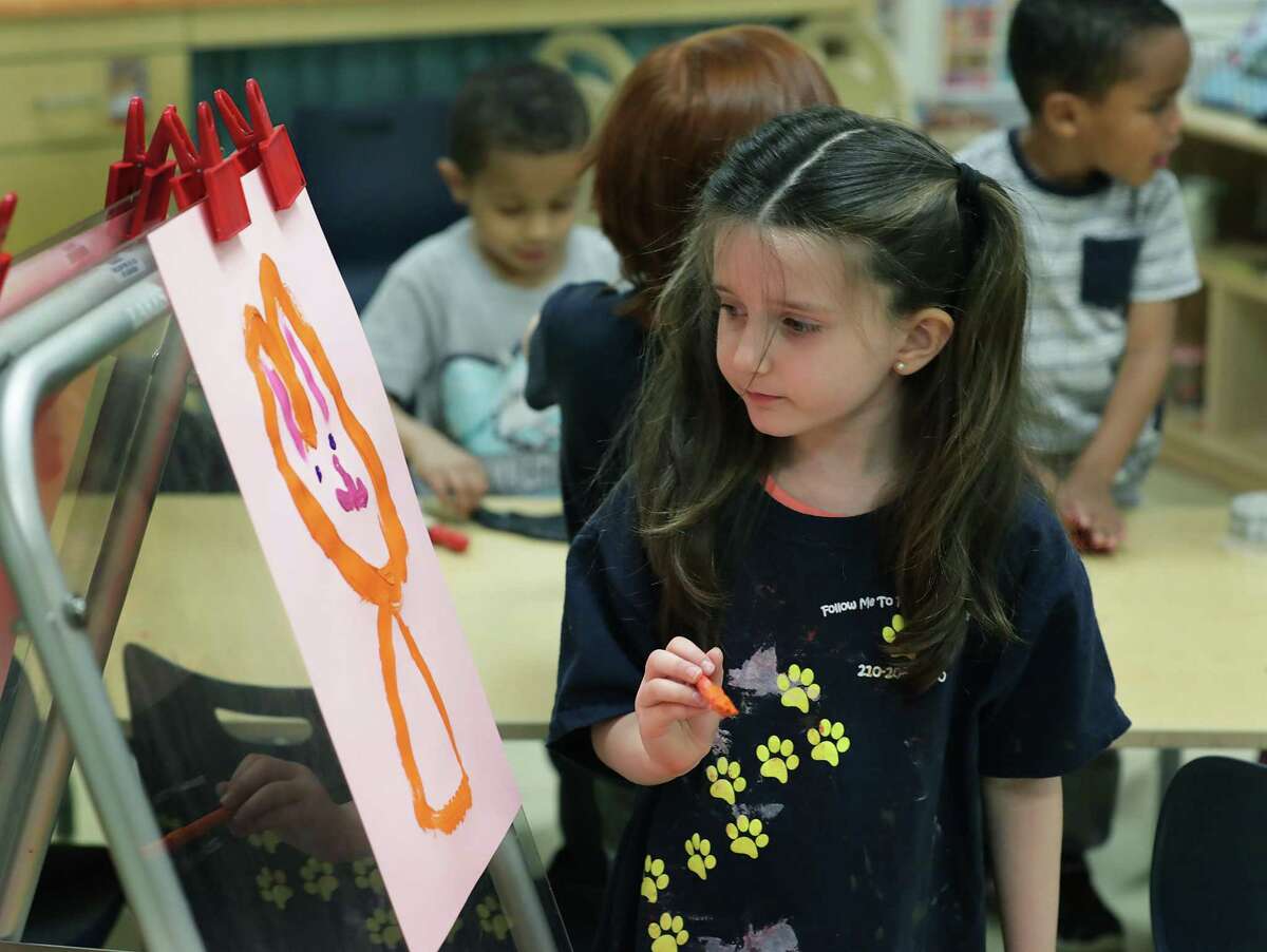 Lillian Jones paints a picture in class at the Pre-K 4 SA North Center last March.
