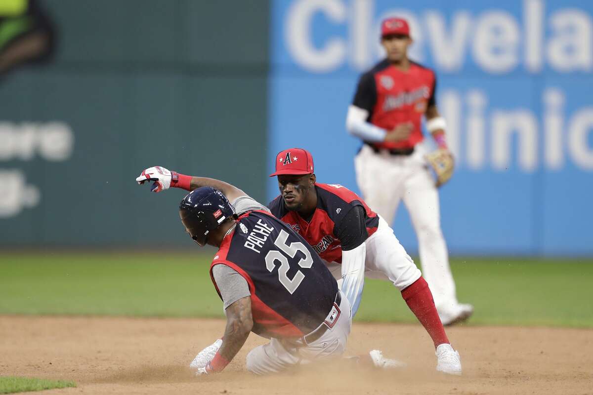 Jorge Mateo, of the Oakland Athletics, tags out Cristian Pache, of the Atlanta Braves, during the seventh inning of the MLB All-Star Futures baseball game, Sunday, July 7, 2019, in Cleveland. The 90th MLB baseball All-Star Game will be played Tuesday. (AP Photo/Tony Dejak)