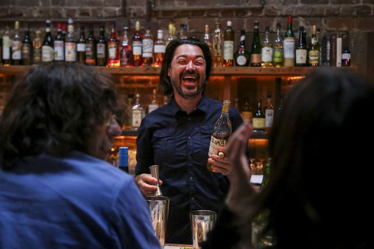Bar Manager Alex Phillips laughs as he makes a drink at Boot & Shoe Service Thursday, June 27, 2019, in Oakland, Calif. A year after new owners Jen Cremer and Richard Clark bought Boot & Shoe Service from Charlie Hallowell, they are unveiling a new name for the restaurant: Sister. The new name is part of the rebranding of the restaurant?•s feel, workplace culture and menu.