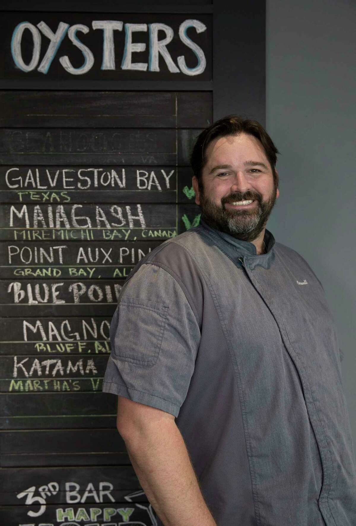 Reef Chef Bryan Caswell poses for a photograph at Reef in July, when the restaurant reopened after  Hurricane Harvey.