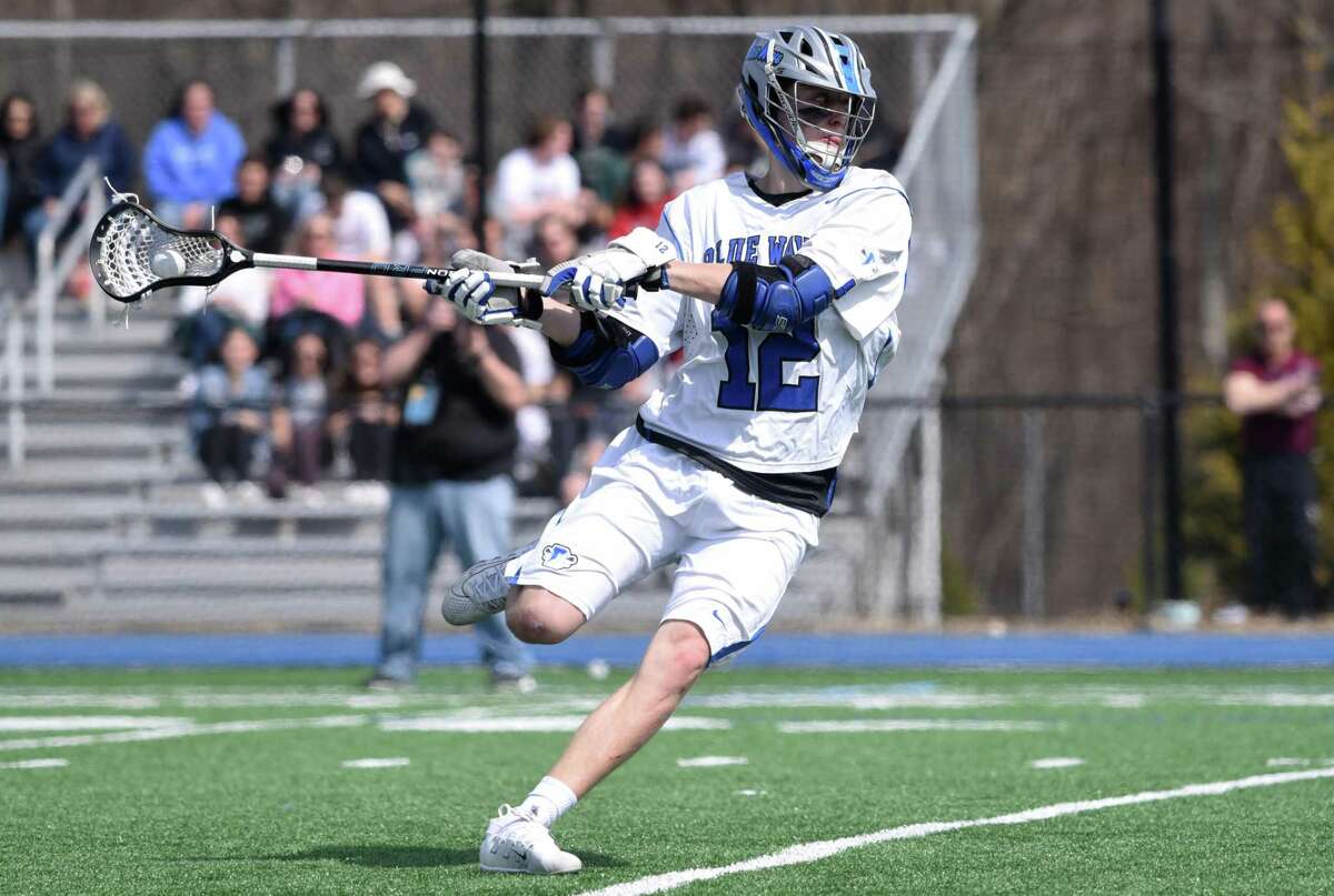 Darien senior co-captain Tommy Hellman lines up a shot during the Blue Wave’s boys lacrosse game against Yorktown (NY) at Darien High School on March 30, 2019.